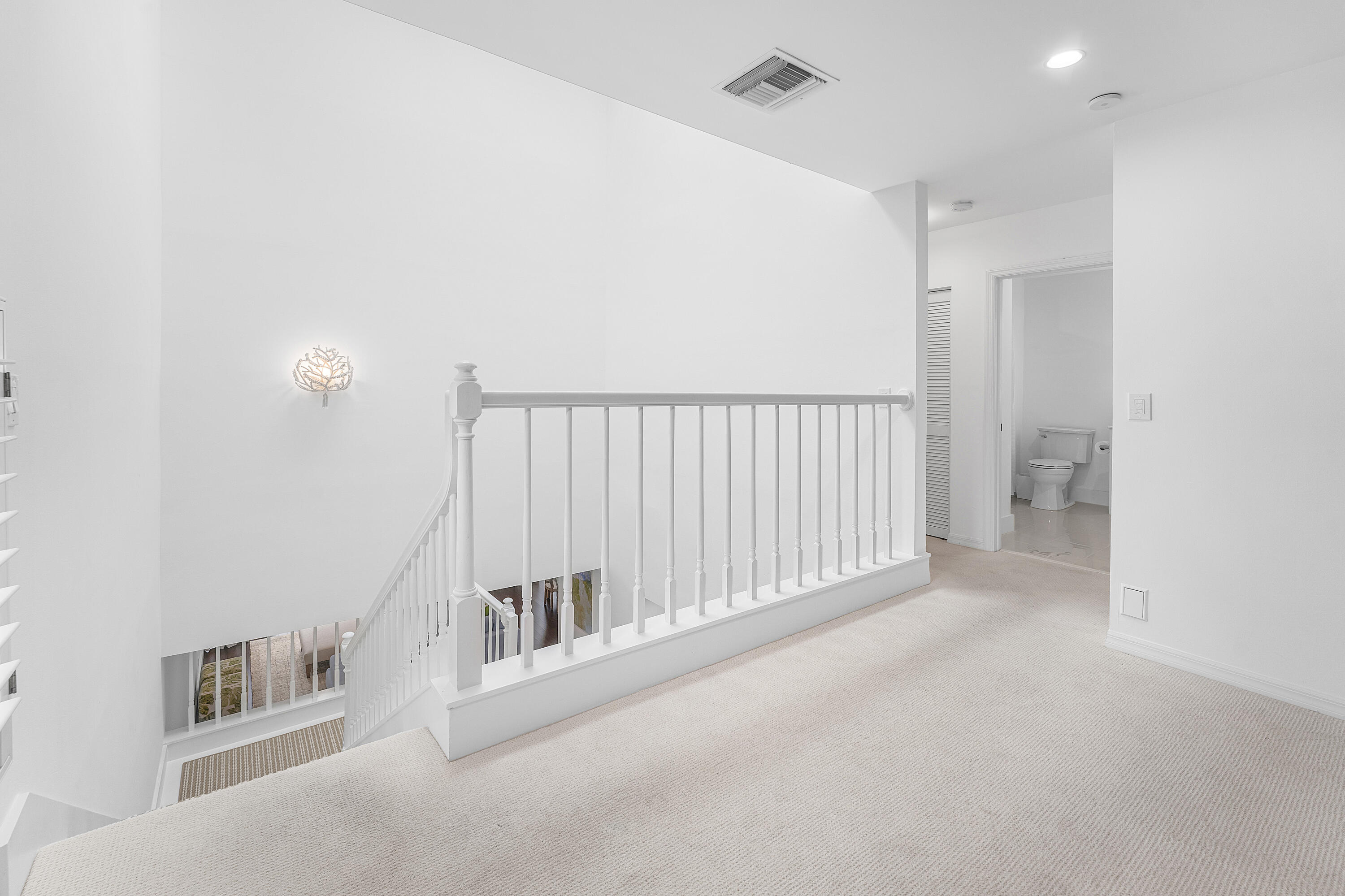 5578 North Ocean Boulevard, Unit 28F Ocean Ridge, FL 33435 - Photo 19 of 47 a view of a hallway with staircase