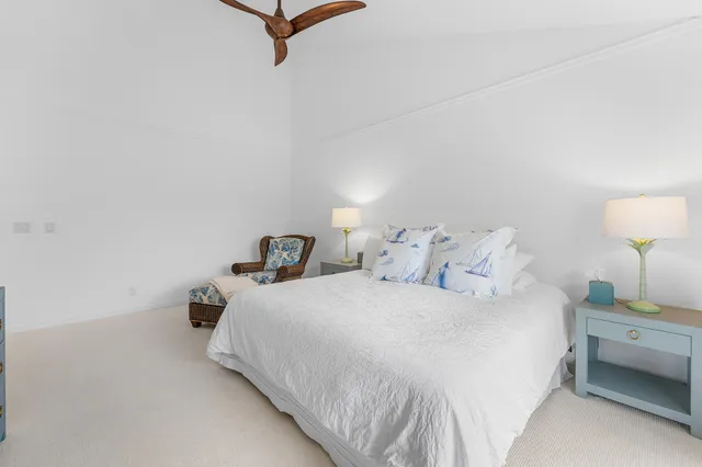 a bedroom with a bed and a night stand