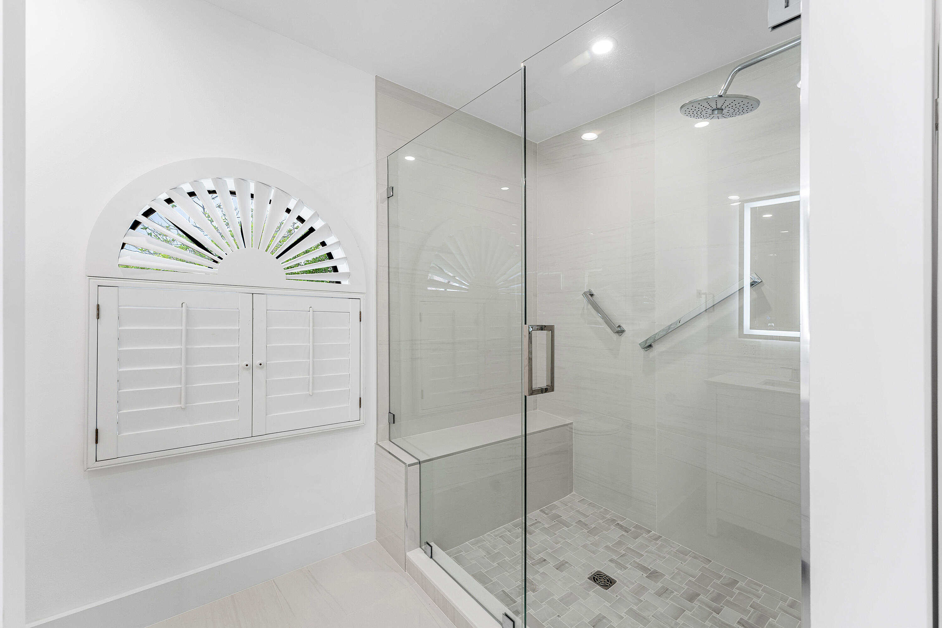 5578 North Ocean Boulevard, Unit 28F Ocean Ridge, FL 33435 - Photo 28 of 47 a bathroom with a shower and a glass door