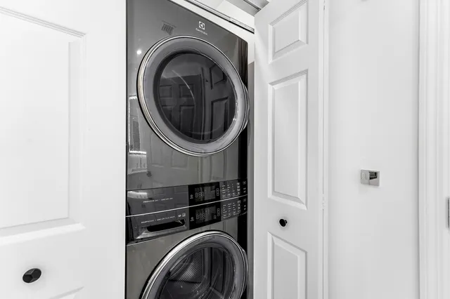 a close view of a utility room with dryer and washer