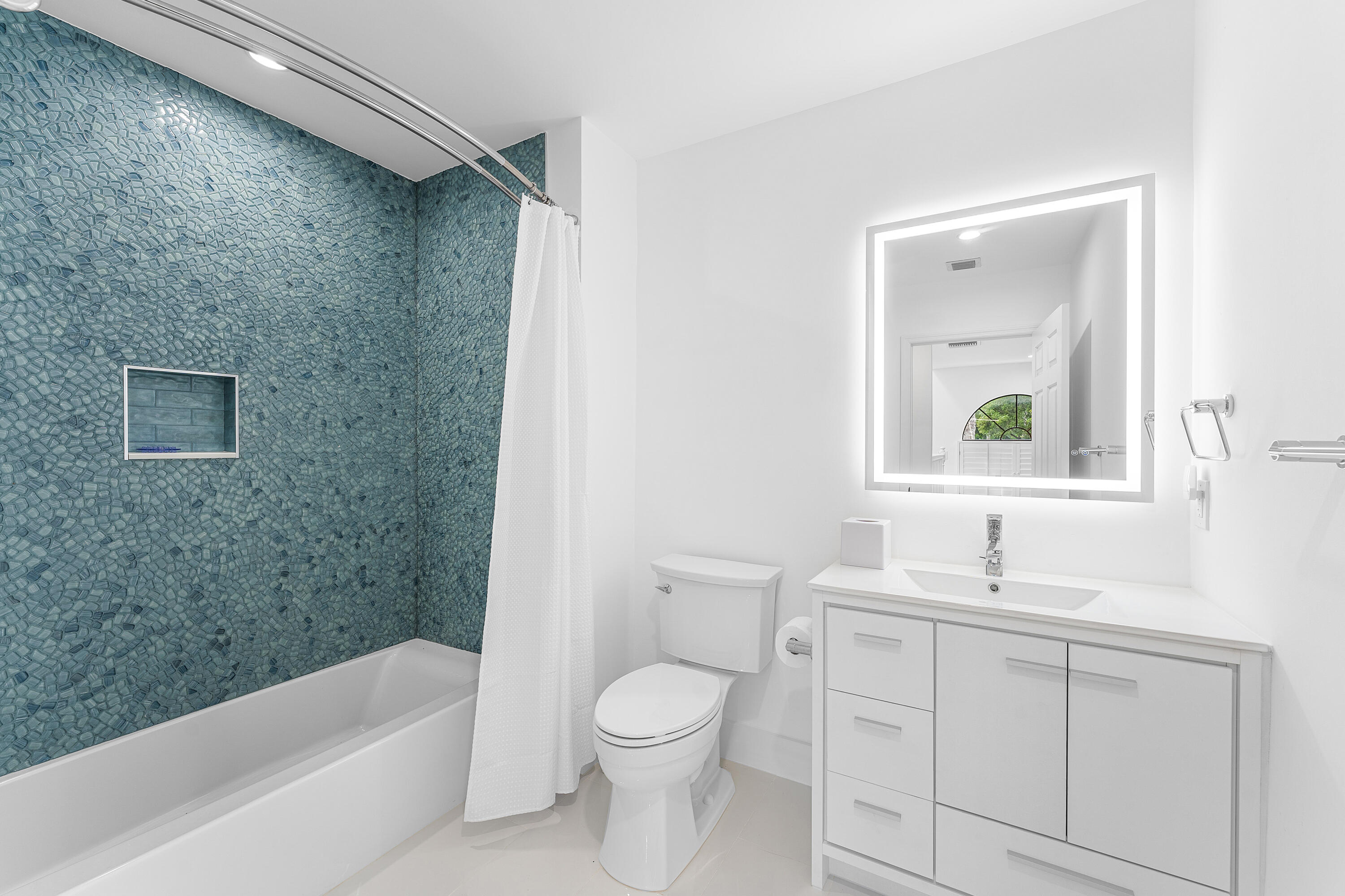 5578 North Ocean Boulevard, Unit 28F Ocean Ridge, FL 33435 - Photo 32 of 47 a bathroom with a granite countertop sink a toilet and shower