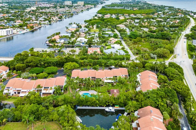 an aerial view of a houses with a lake view