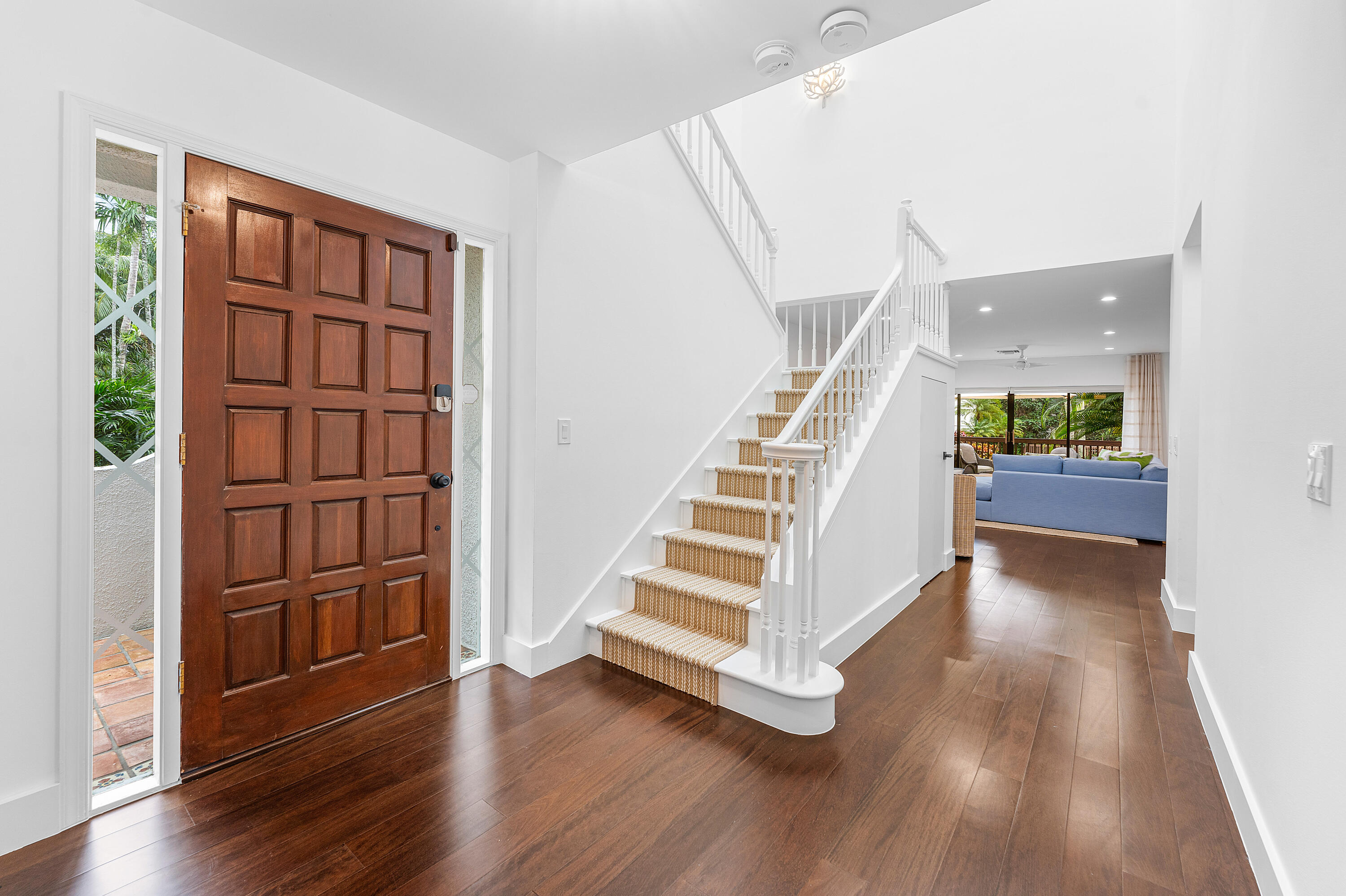 5578 North Ocean Boulevard, Unit 28F Ocean Ridge, FL 33435 - Photo 4 of 47 a view of entryway with wooden floor and stairs