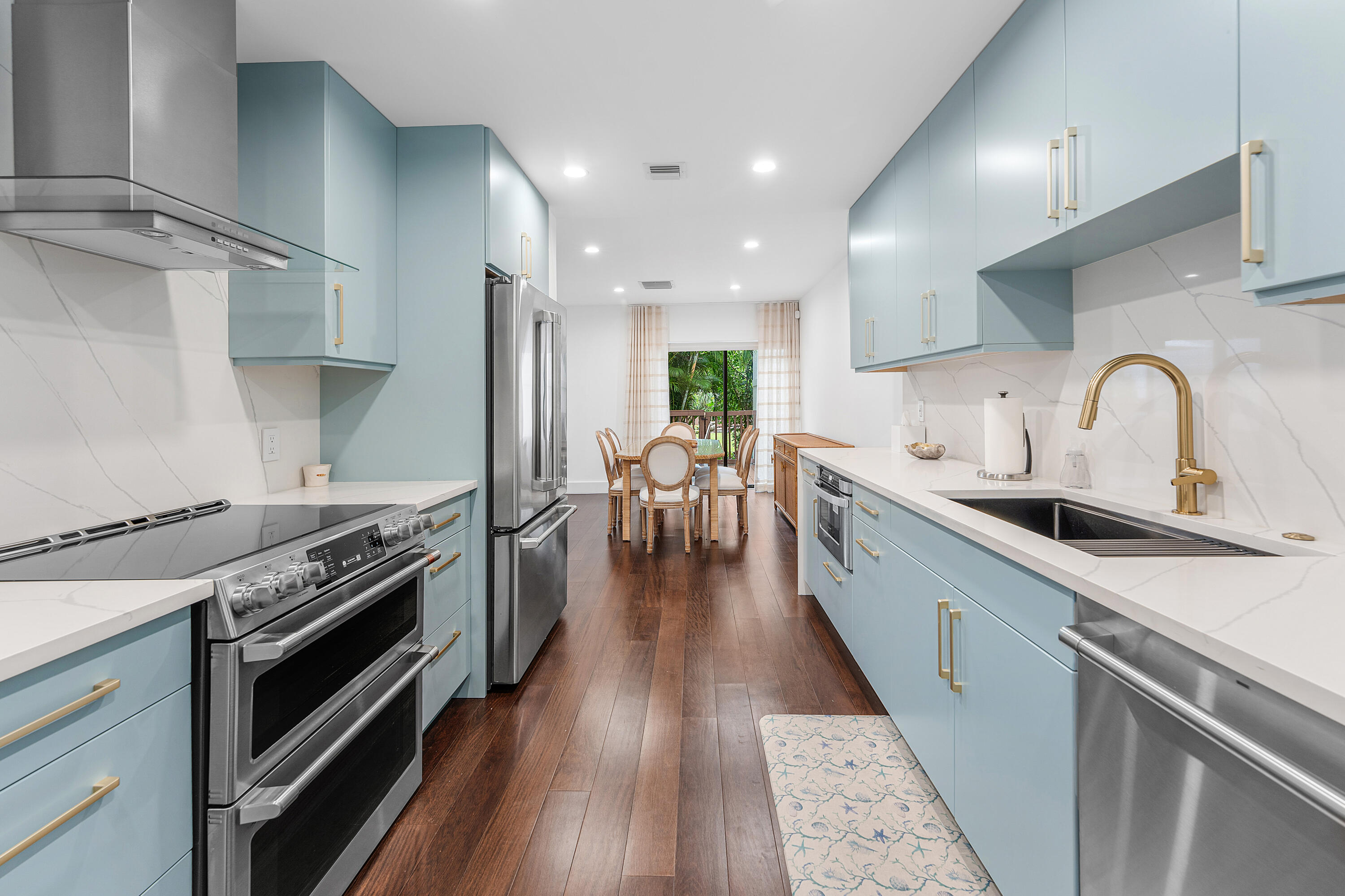 5578 North Ocean Boulevard, Unit 28F Ocean Ridge, FL 33435 - Photo 5 of 47 a kitchen with granite countertop a stove and a sink