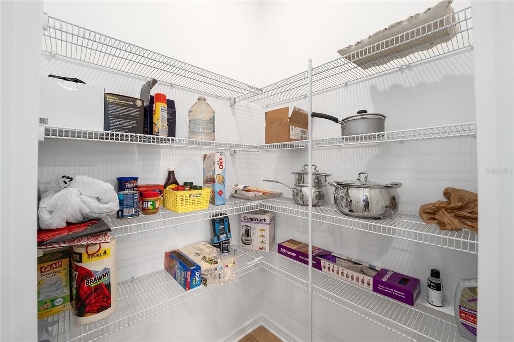 8491 Southwest 52nd Ln Road Ocala, FL 34481 - Photo 15 of 45 a kitchen with lots of clutter and cabinets