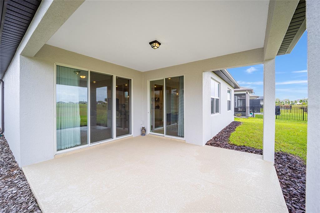 8491 Southwest 52nd Ln Road Ocala, FL 34481 - Photo 34 of 45 a bedroom with a bed and a large window