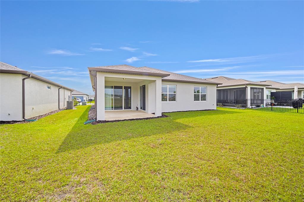 8491 Southwest 52nd Ln Road Ocala, FL 34481 - Photo 36 of 45 a view of a house with a swimming pool