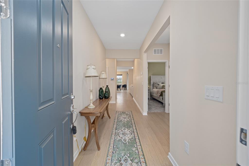 8491 Southwest 52nd Ln Road Ocala, FL 34481 - Photo 4 of 45 a living room with furniture and a wooden floor