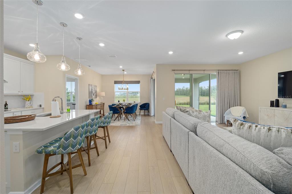 8491 Southwest 52nd Ln Road Ocala, FL 34481 - Photo 10 of 45 a living room with furniture kitchen and a table