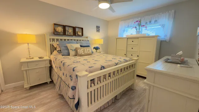 a bedroom with a bed and a table in it