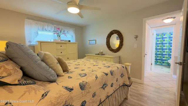 a bedroom with a bed and a mirror