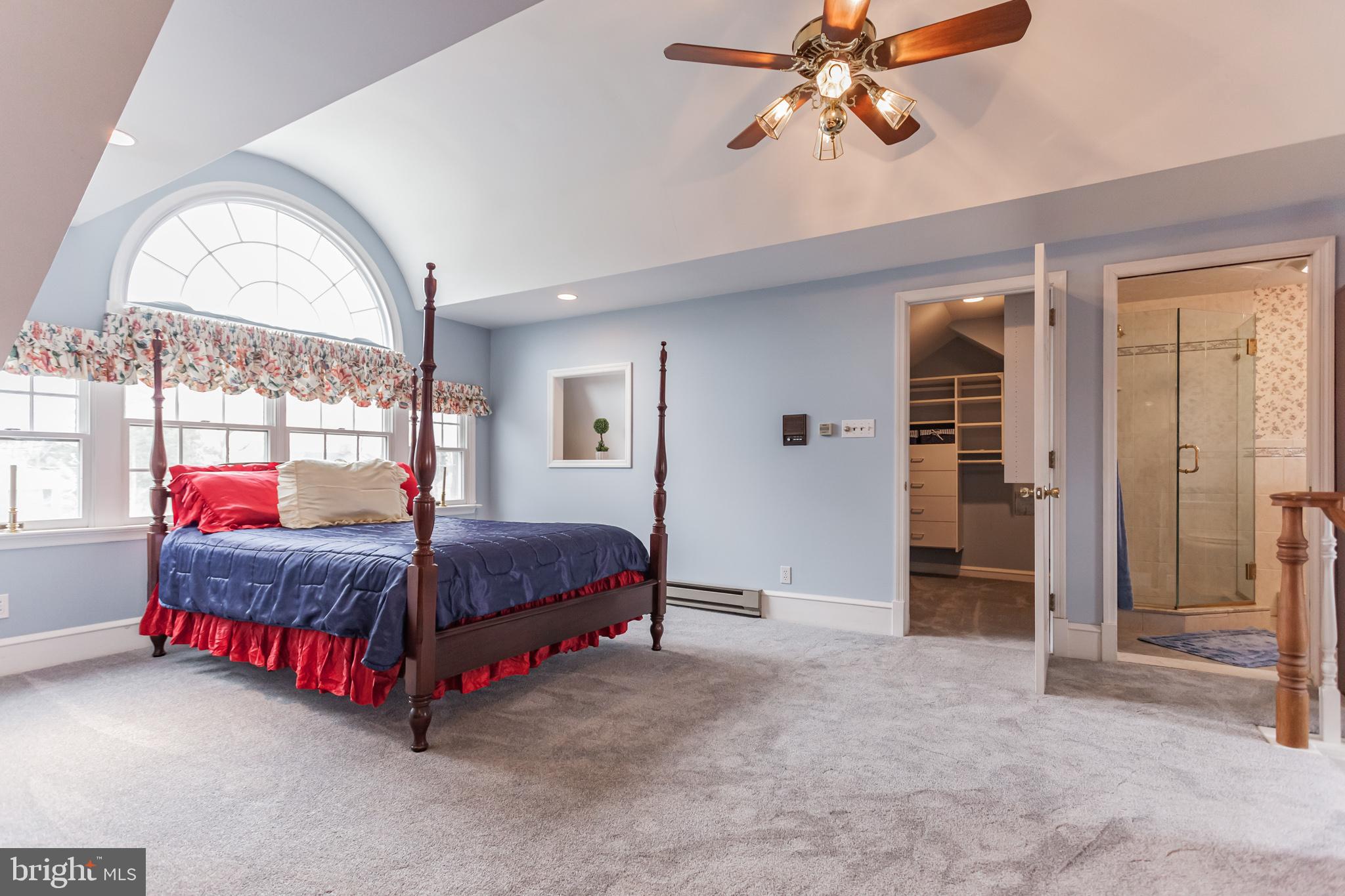 316 Chestnut Street Haddonfield, NJ 08033 - Photo 16 of 30 a living room with a bed dresser and a large window