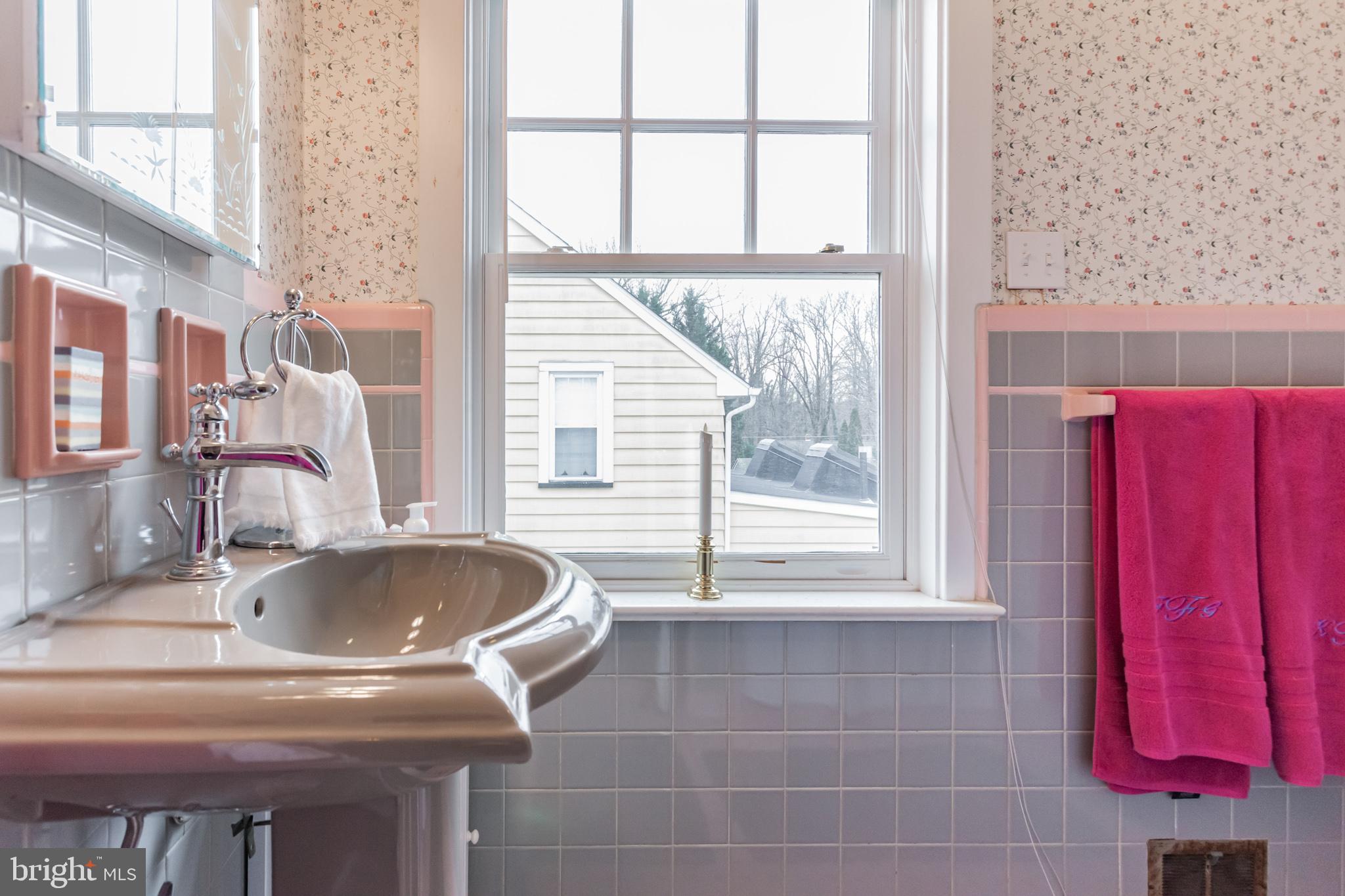 316 Chestnut Street Haddonfield, NJ 08033 - Photo 25 of 30 a bathroom with a granite countertop sink and a window