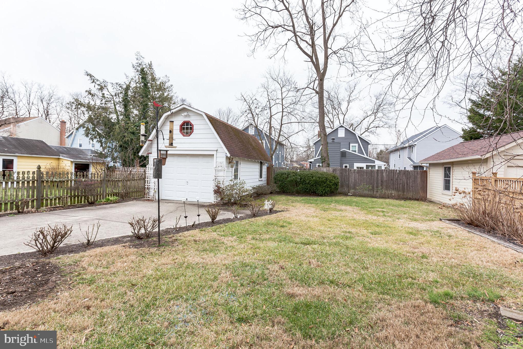 316 Chestnut Street Haddonfield, NJ 08033 - Photo 30 of 30 a view of a white house next to a yard with a large tree