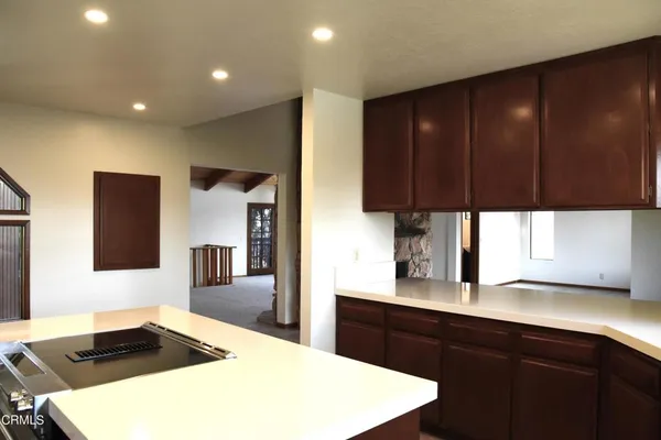 a kitchen with a sink and wooden cabinets
