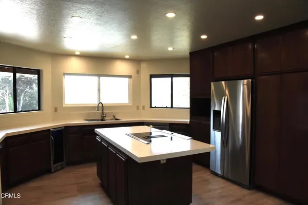 a kitchen with a sink and refrigerator