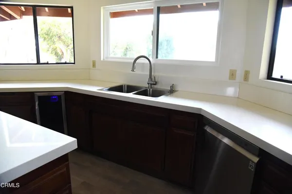 a kitchen with a sink and a window