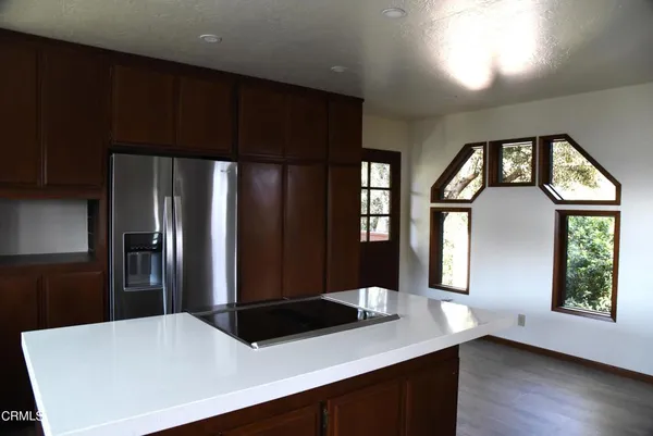 a kitchen with stainless steel appliances a refrigerator and a sink