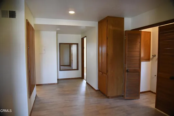 a view of entryway with wooden floor