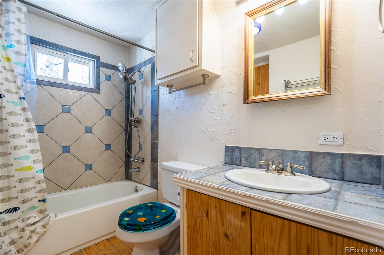 252 Jones Road Bailey, CO 80421 - Photo 14 of 36 a bathroom with a sink a bathtub and a shower