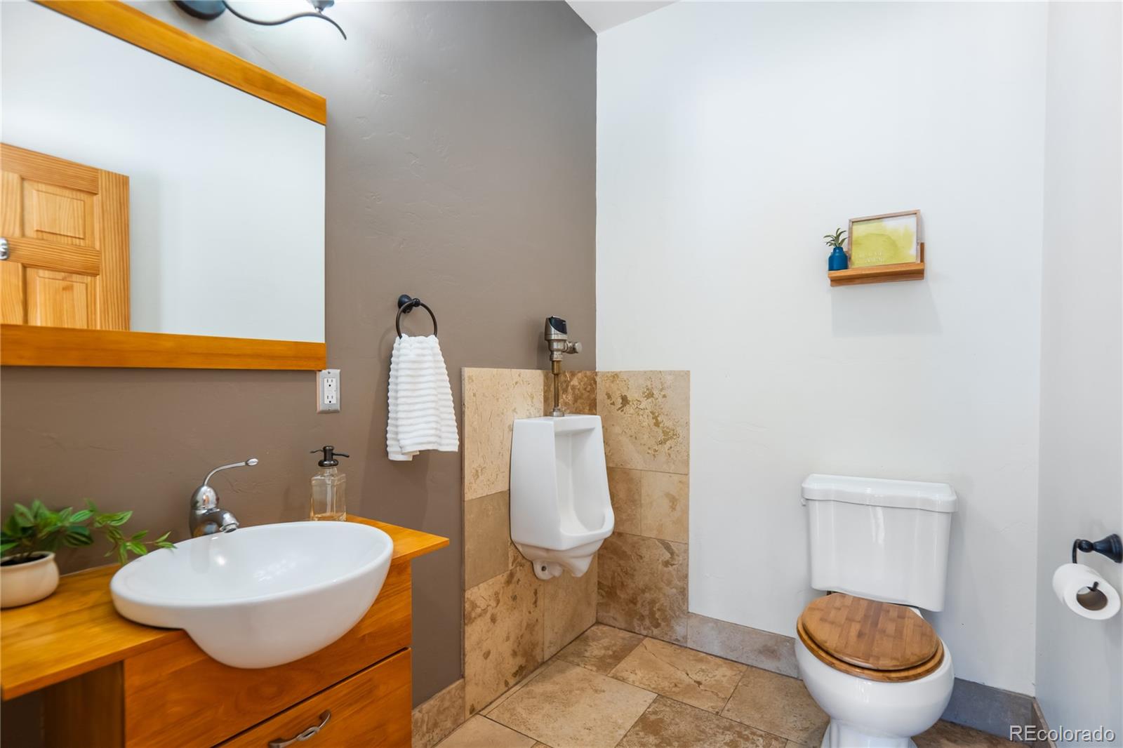 252 Jones Road Bailey, CO 80421 - Photo 25 of 36 a bathroom with a toilet sink and mirror