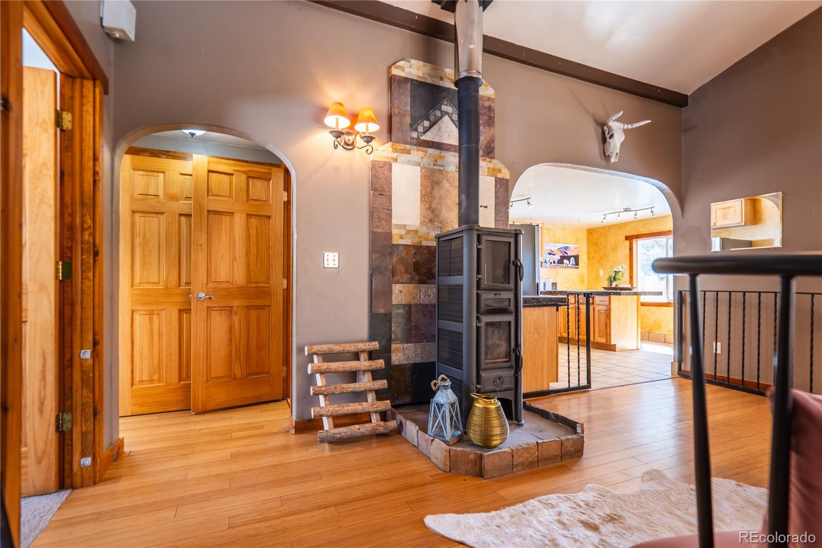252 Jones Road Bailey, CO 80421 - Photo 10 of 36 a view of a livingroom with furniture a dinning room and chandelier
