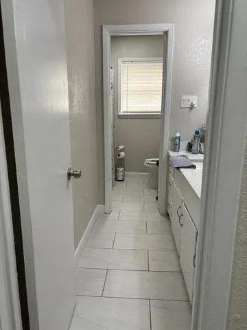 a view of a swimming pool with an outdoor space and seating area