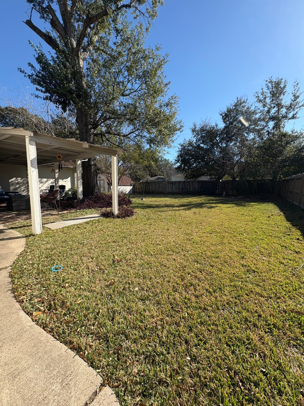 10226 Old Orchard Road La Porte, TX 77571 - Photo 4 of 6 a view of a swimming pool with an outdoor space and seating area