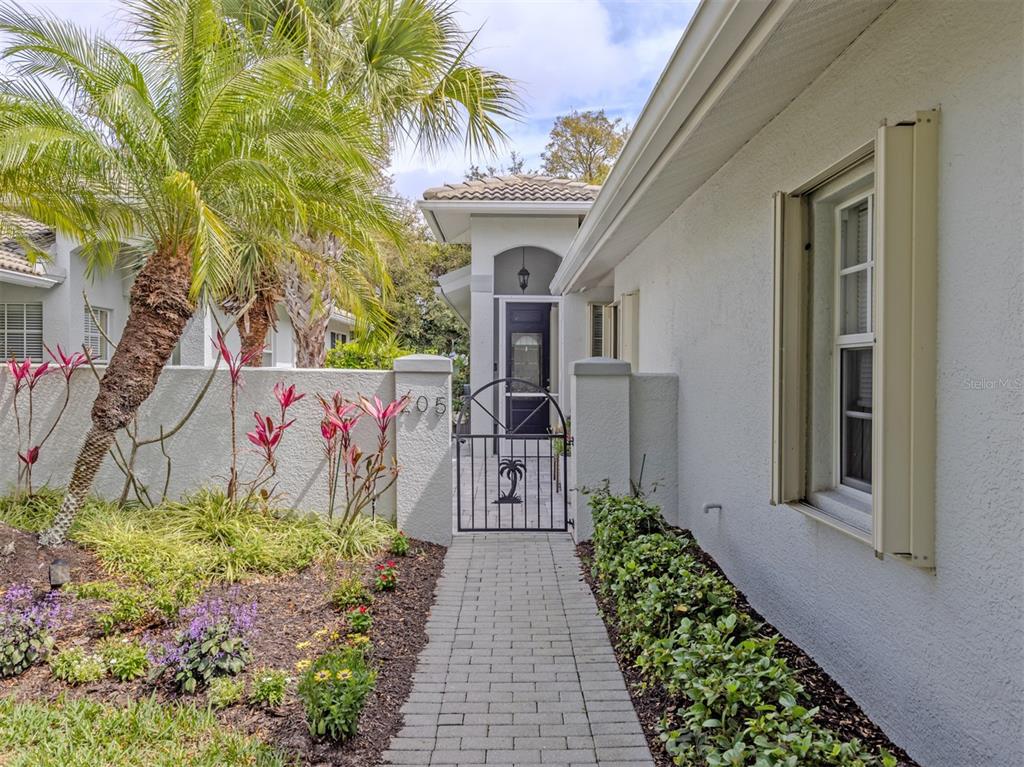 205 Reclinata Circle Venice, FL 34292 - Photo 3 of 62 a front view of a house with a pathway and a pathway