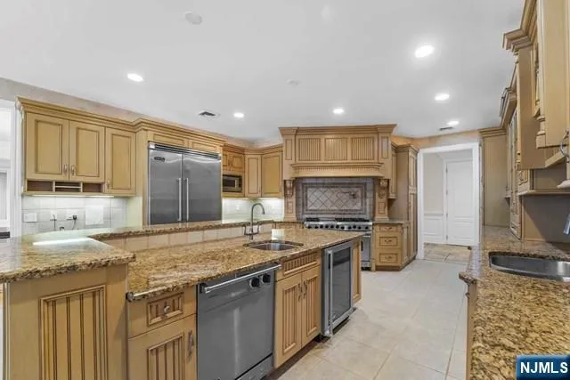 a living room with furniture and large windows