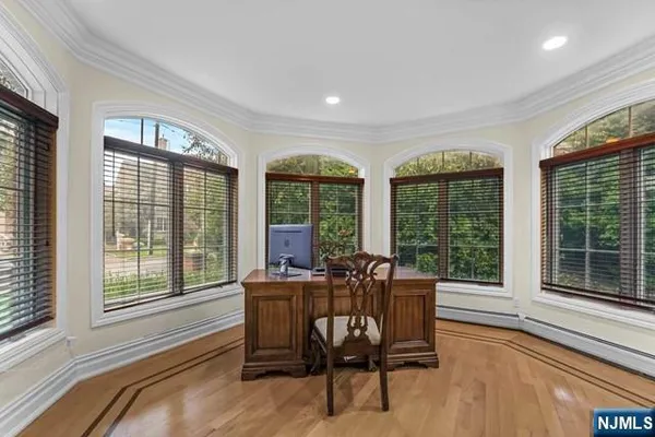 a living room with furniture a table and kitchen view