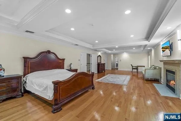 a bathroom with a sink a large mirror and a shower