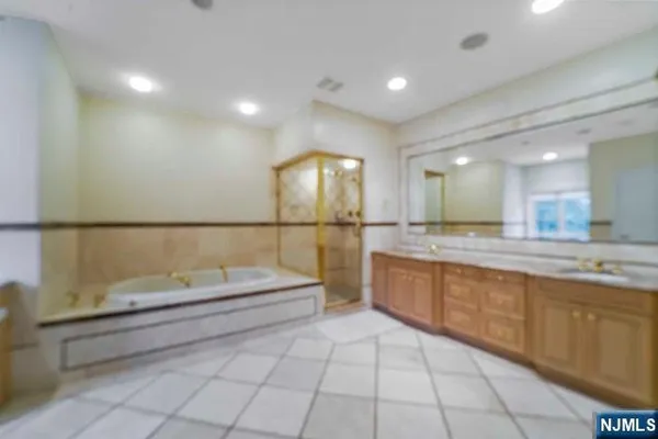 a bathroom with a granite countertop sink mirror and double