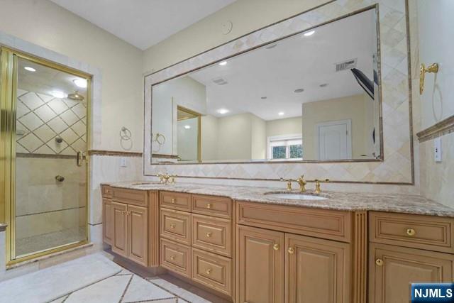 1 Euclid Road Fort Lee, NJ 07024 - Photo 27 of 50 a bathroom with a granite countertop sink mirror and double