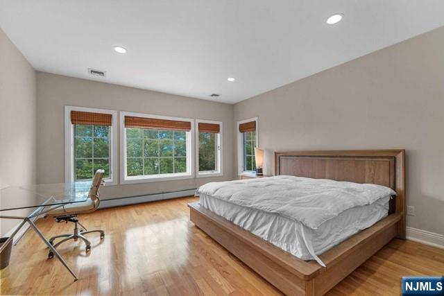 1 Euclid Road Fort Lee, NJ 07024 - Photo 28 of 50 a bedroom with a large bed and large windows