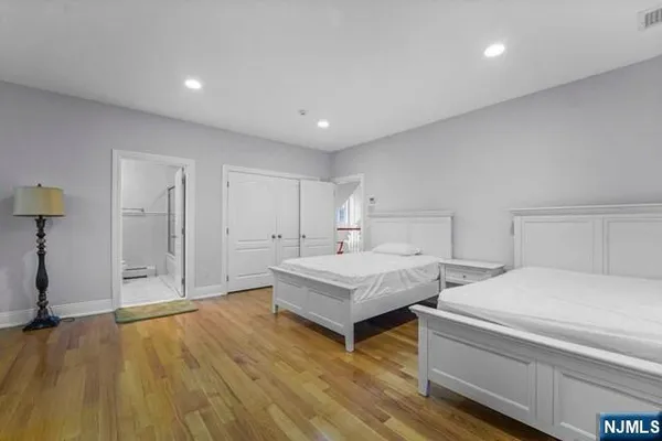 a bathroom with a granite countertop sink toilet a mirror and shower