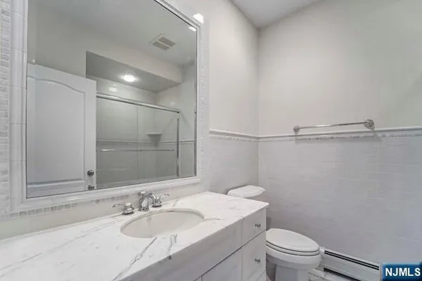 a bedroom with bed and window