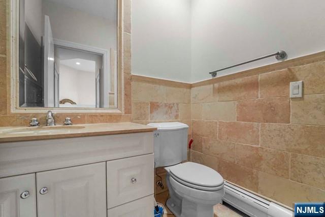 1 Euclid Road Fort Lee, NJ 07024 - Photo 34 of 50 a bathroom with a sink a toilet and a mirror