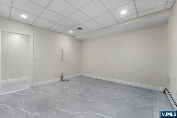 a bathroom with a shower a toilet and sink