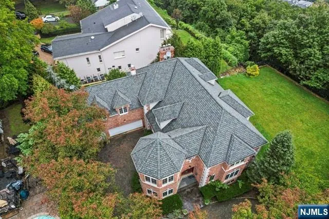 an aerial view of a house with a garden