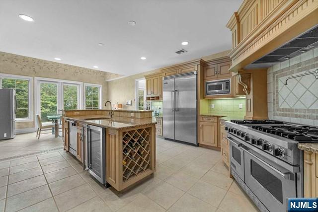 1 Euclid Road Fort Lee, NJ 07024 - Photo 10 of 50 a kitchen with stainless steel appliances granite countertop a stove and a sink