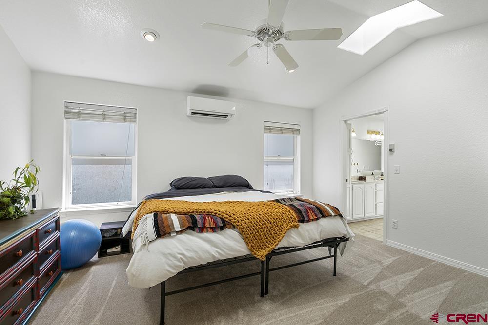 213 Jenkins Ranch Road, Unit A Durango, CO 81301 - Photo 13 of 35 a bedroom with bed and window