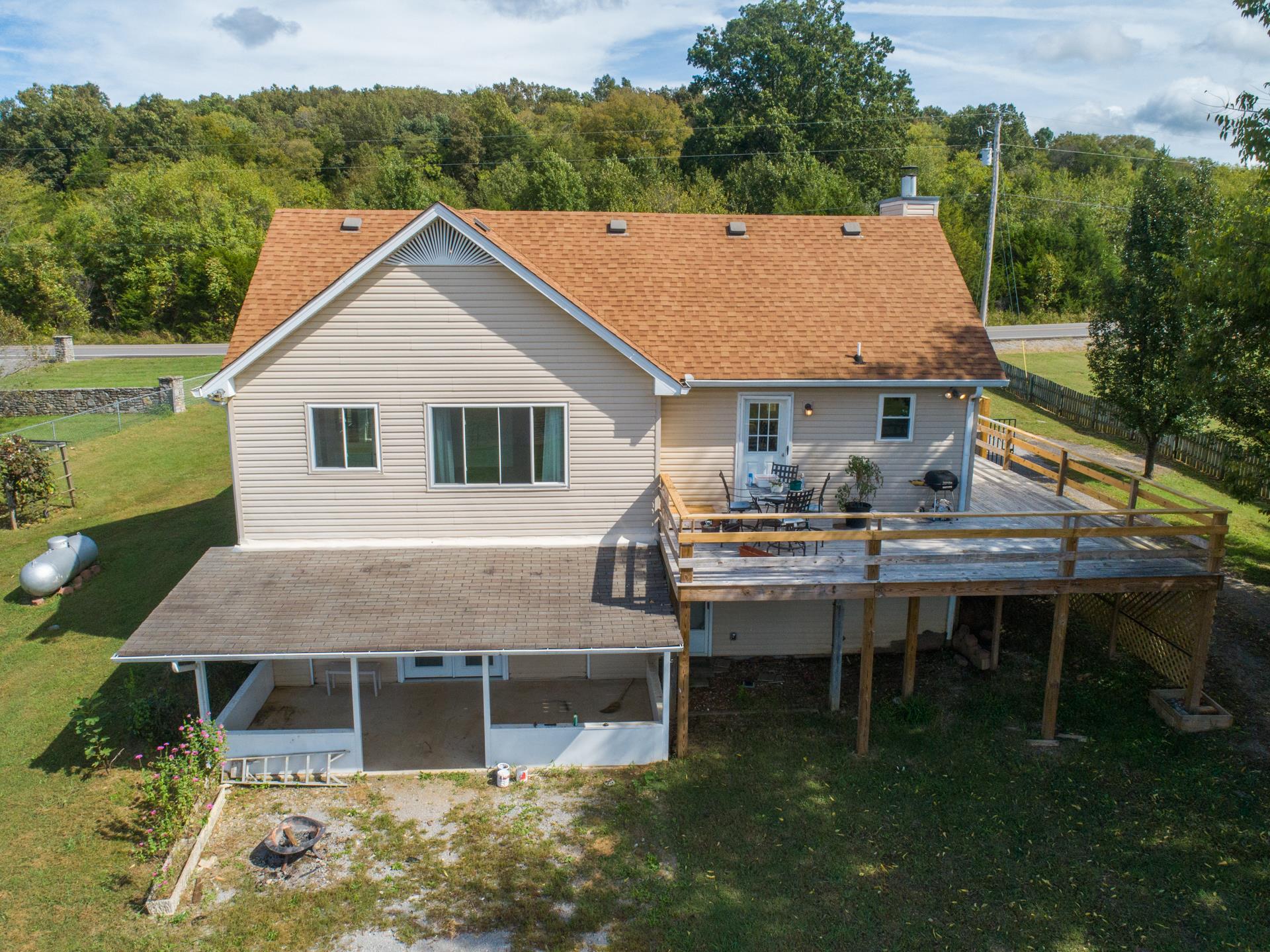1046 Rocky Valley Road Lebanon, TN 37090 - Photo 22 of 30 With a wrap around deck, a covered patio and a separate covered area, there is plenty of room to entertain ...