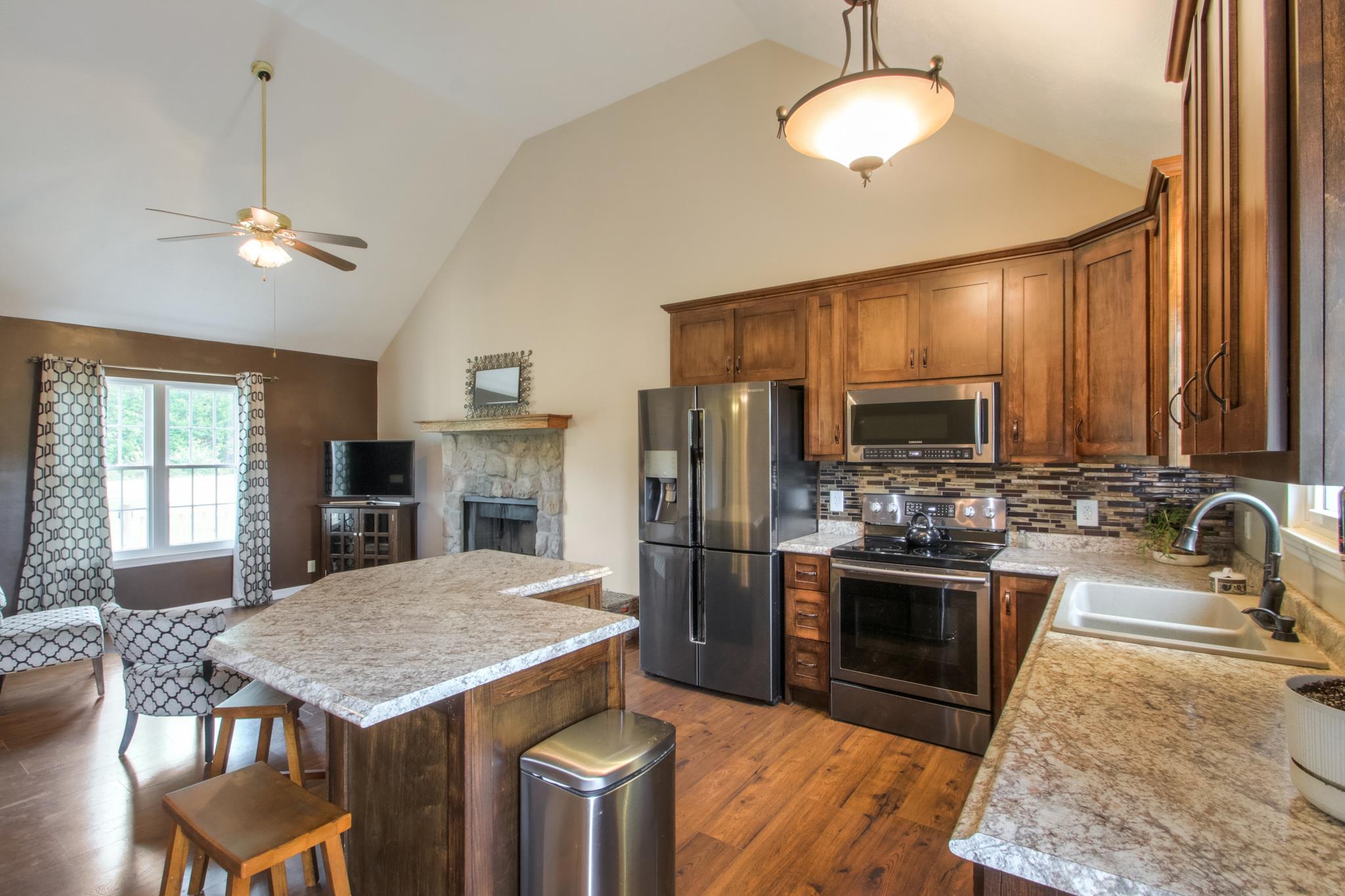 The kitchen has a smooth top stove, single oven, built in microwave, dishwasher...