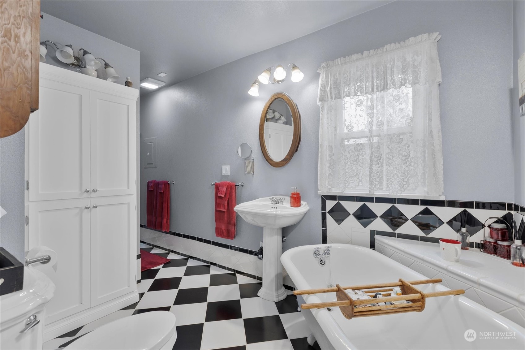 20925 Conway Frontage Road Mount Vernon, WA 98273 - Photo 18 of 40 a bathroom with a sink a toilet and a mirror