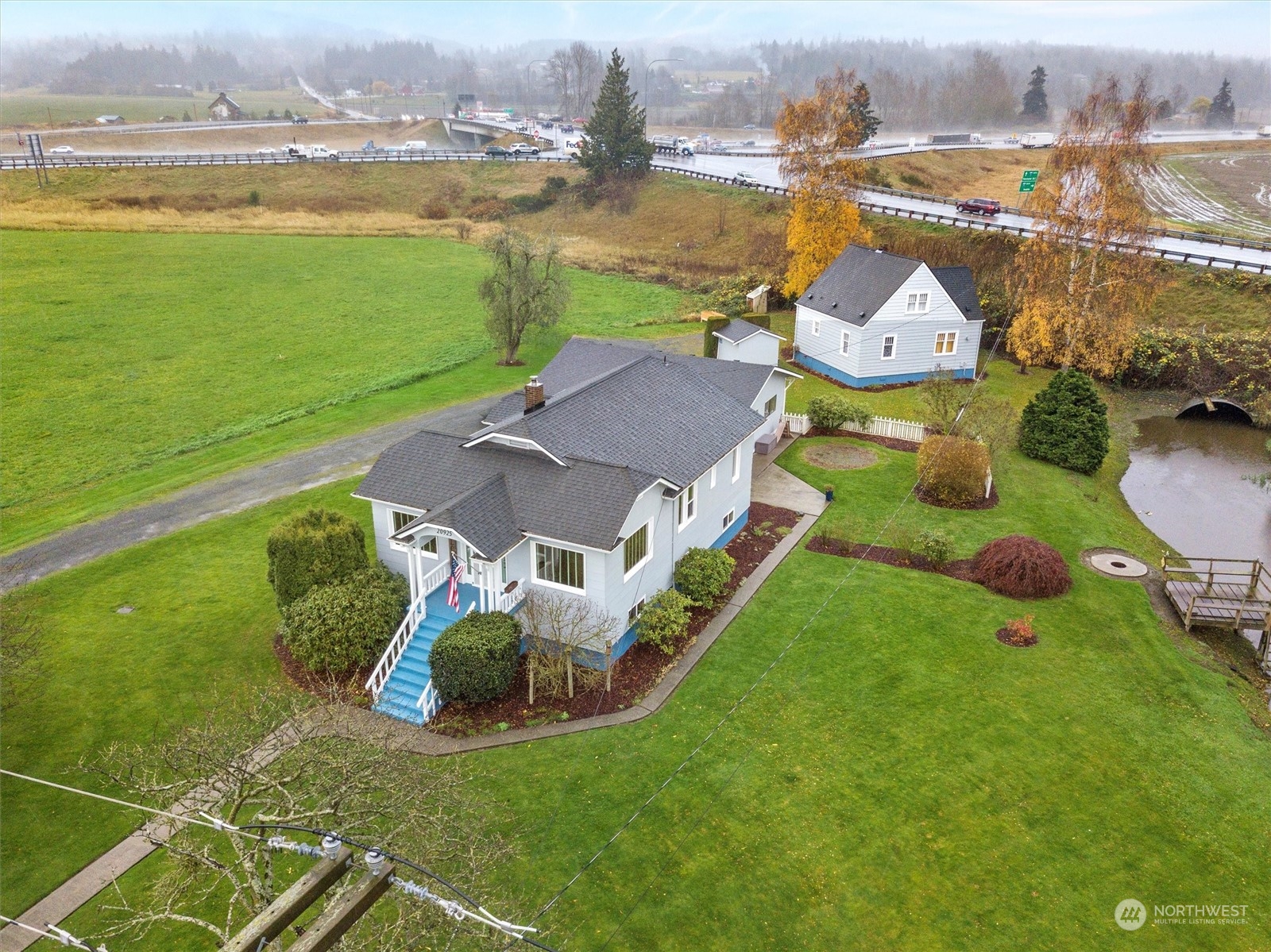 20925 Conway Frontage Road Mount Vernon, WA 98273 - Photo 33 of 40 an aerial view of a house with outdoor space swimming pool and ocean view