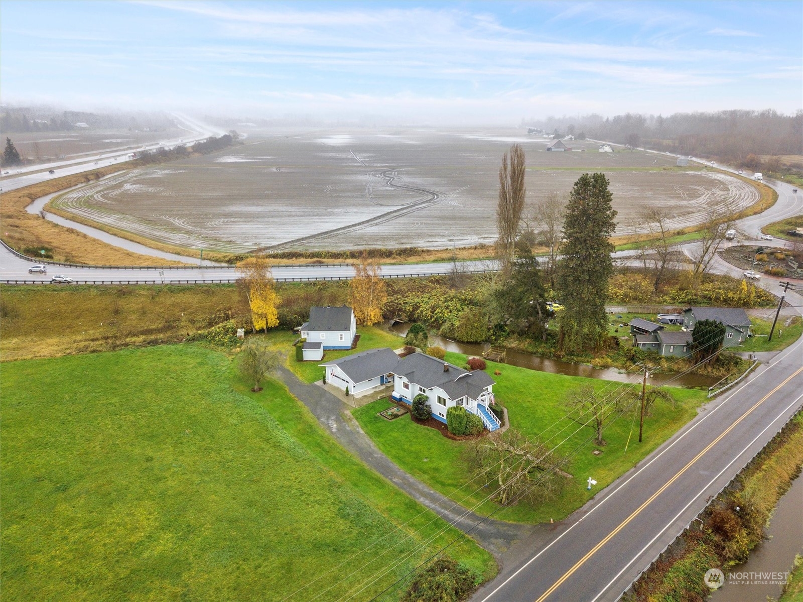 20925 Conway Frontage Road Mount Vernon, WA 98273 - Photo 37 of 40 a view of a lake from a balcony