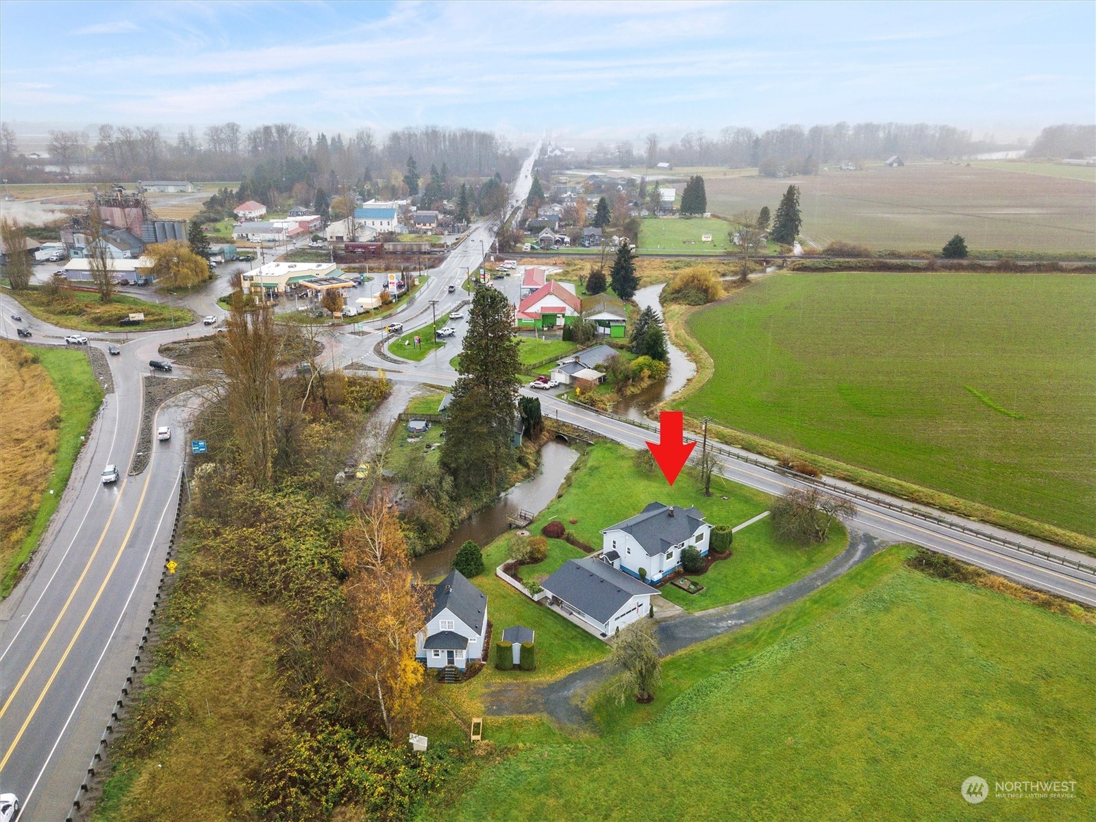 20925 Conway Frontage Road Mount Vernon, WA 98273 - Photo 39 of 40 an aerial view of residential houses with outdoor space and ocean view