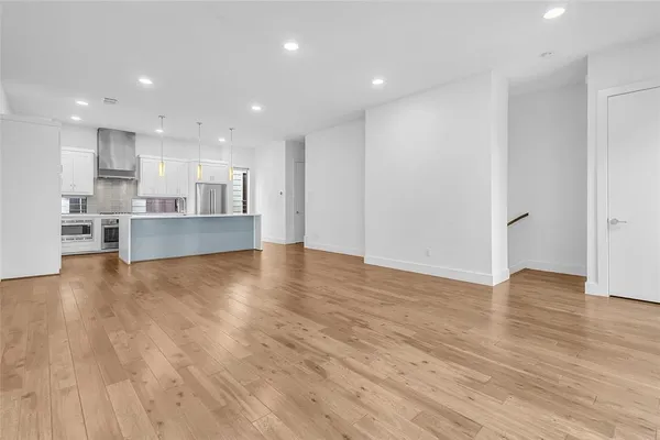 a view of kitchen with wooden floor and center island