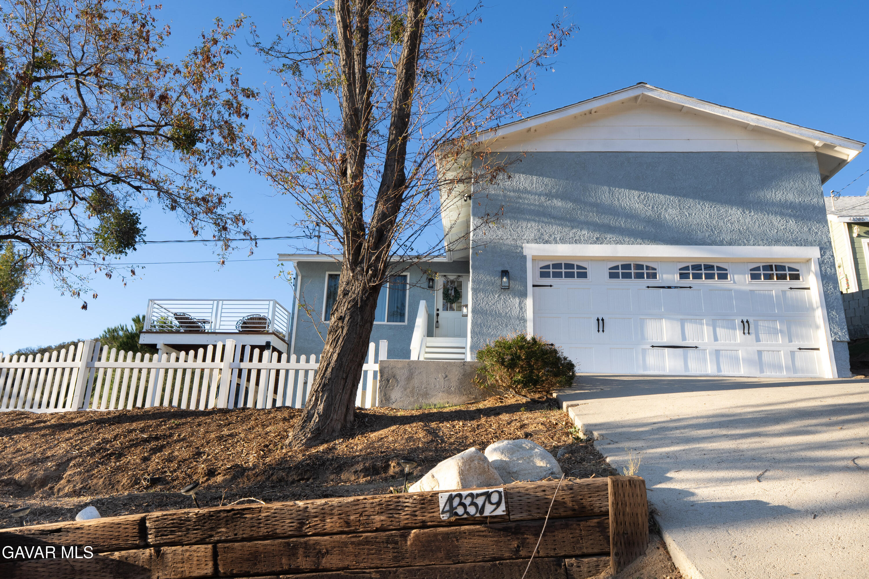 43379 Lookabout Road Lake Hughes, CA 93532 - Photo 15 of 50 a front view of a house with a yard